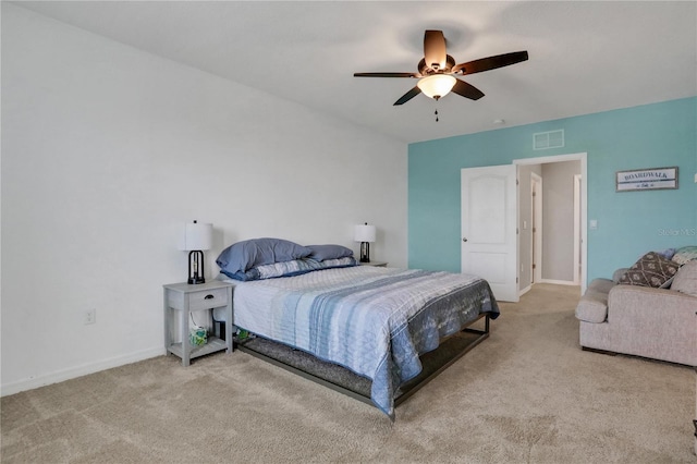 bedroom featuring light colored carpet and ceiling fan