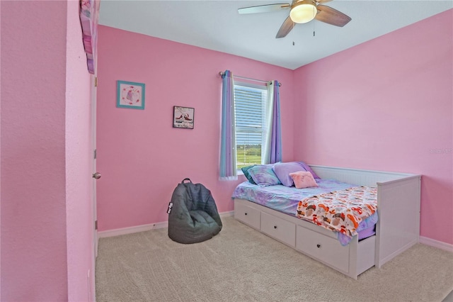 bedroom featuring light carpet and ceiling fan