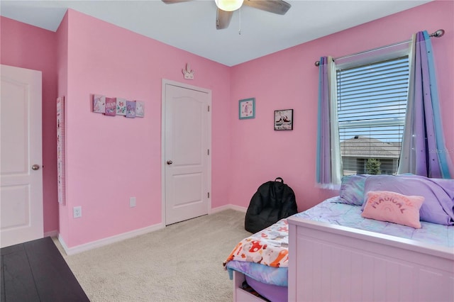 bedroom with ceiling fan and light carpet