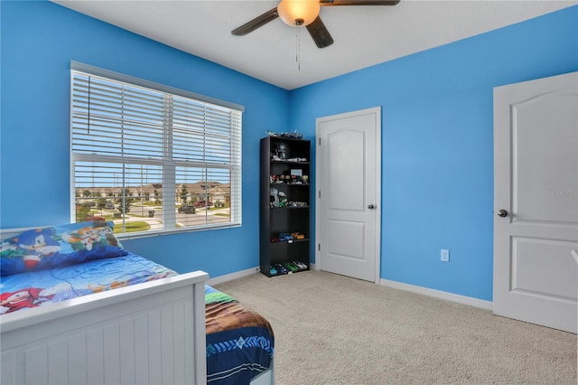 carpeted bedroom featuring ceiling fan