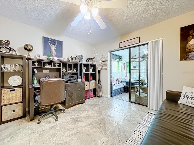 office space featuring ceiling fan and a textured ceiling