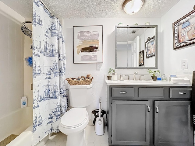 full bathroom featuring shower / bath combination with curtain, vanity, toilet, and a textured ceiling