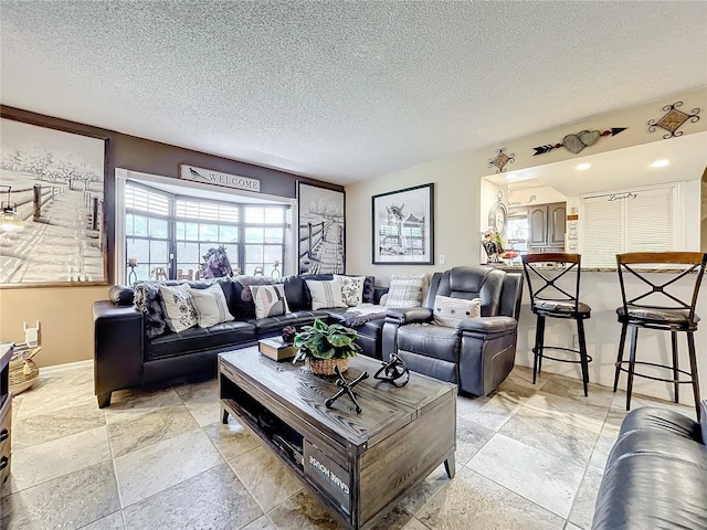 living room featuring a textured ceiling