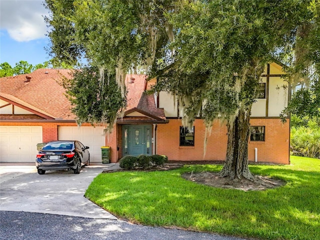 view of front of home with a garage and a front lawn