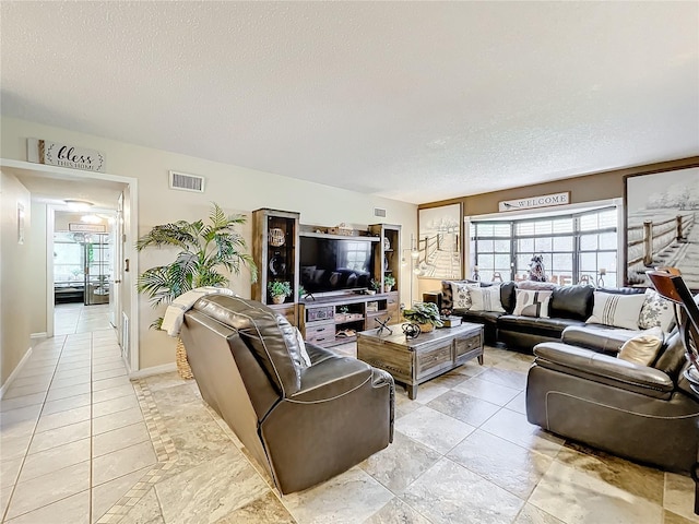 living room with a textured ceiling