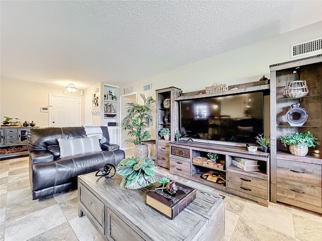 living room with a textured ceiling