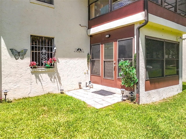 property entrance featuring a yard