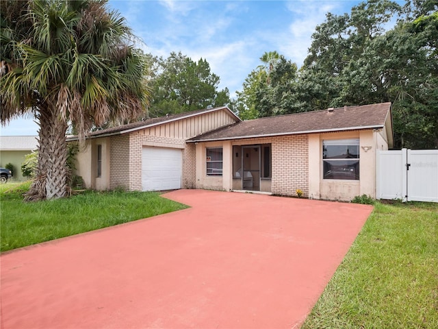 view of front of home with a garage and a front lawn