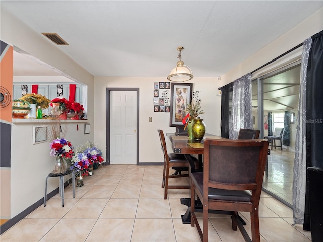 dining area featuring light tile patterned floors