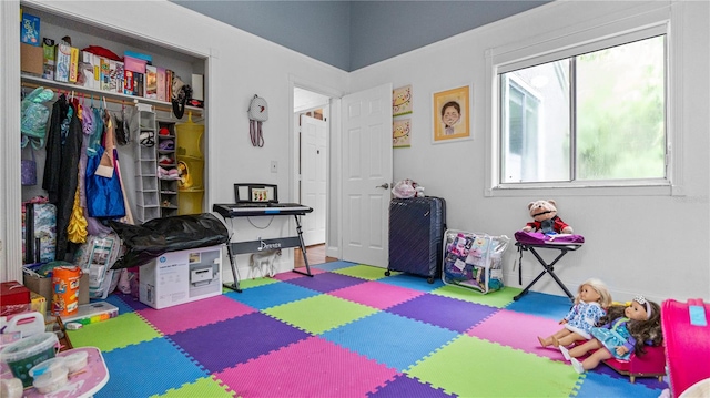 recreation room with hardwood / wood-style floors