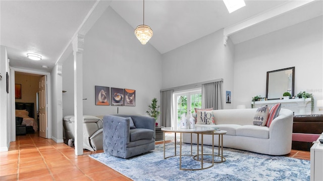 living room with high vaulted ceiling and tile patterned floors