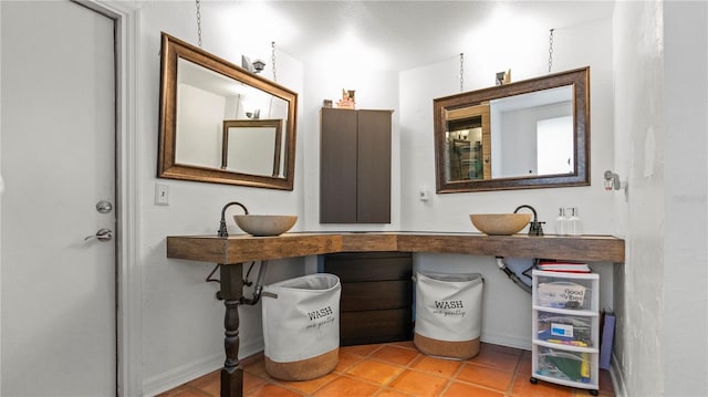 bathroom featuring sink and tile patterned flooring