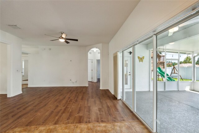 spare room with ceiling fan and hardwood / wood-style floors