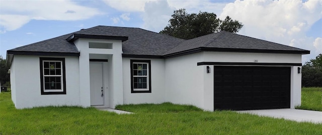 view of front facade featuring a garage and a front lawn