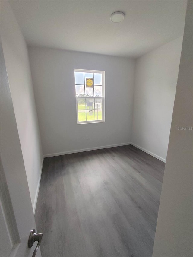 unfurnished room featuring wood-type flooring