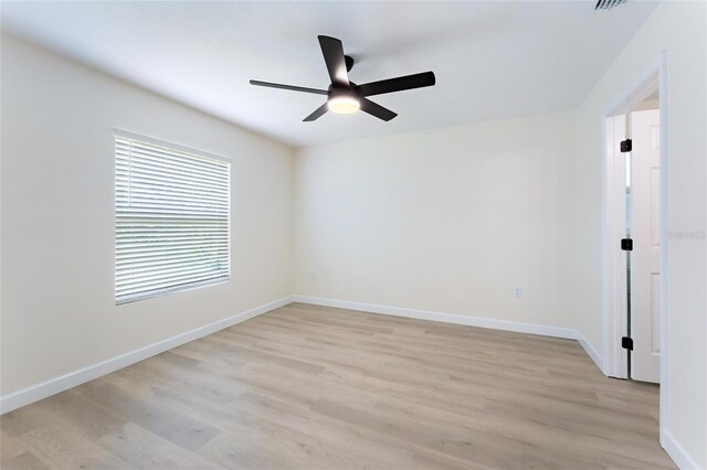 unfurnished room featuring ceiling fan and light hardwood / wood-style floors