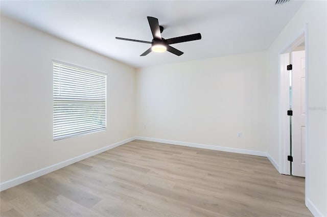 unfurnished room featuring light wood-type flooring and ceiling fan