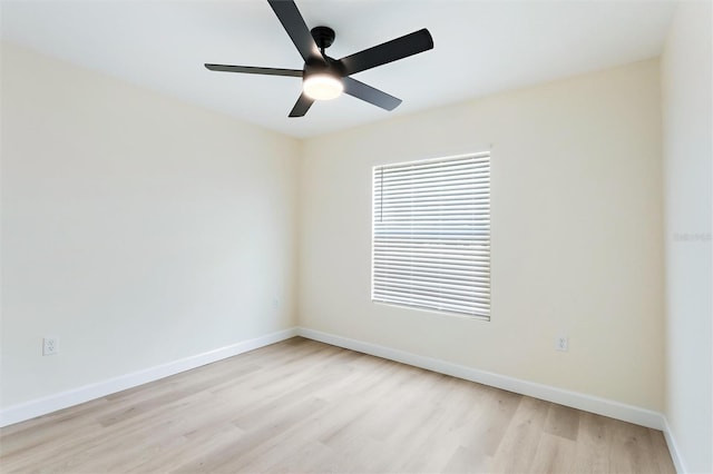 empty room with ceiling fan and light hardwood / wood-style flooring