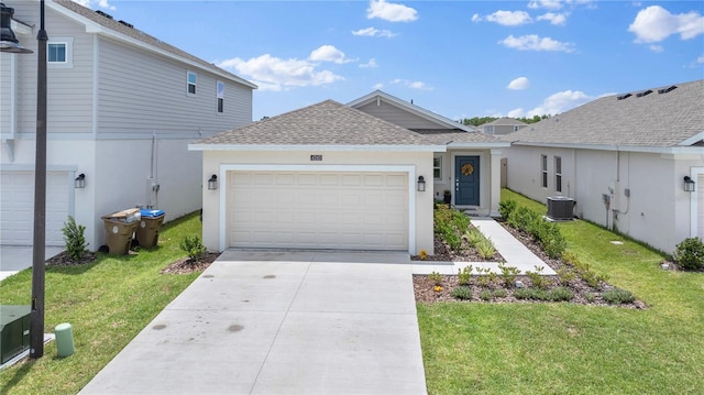 ranch-style house with an attached garage, central AC, concrete driveway, stucco siding, and a front yard