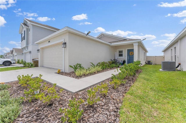 view of front facade with concrete driveway, an attached garage, cooling unit, a front lawn, and stucco siding