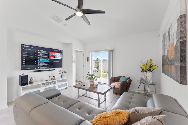 tiled living room with ceiling fan and vaulted ceiling