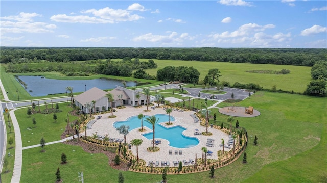 view of swimming pool featuring a rural view and a water view