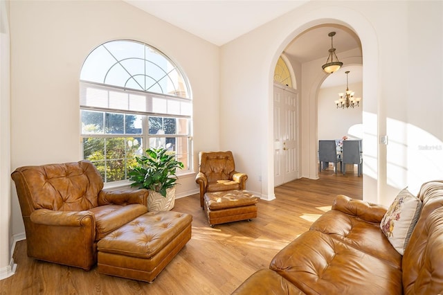 interior space featuring a notable chandelier and light hardwood / wood-style floors