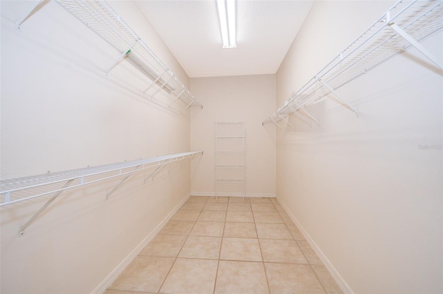 spacious closet with tile patterned flooring