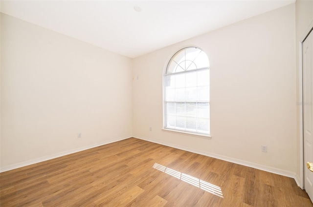 spare room with light wood-type flooring