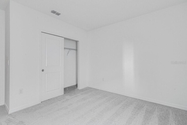 349 River Front Way, Edgewater, FL 32141 - unfurnished bedroom with light carpet and a closet