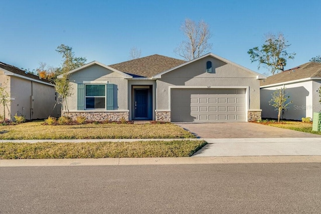 349 River Front Way, Edgewater, FL 32141 - view of front of home with a garage and a front yard
