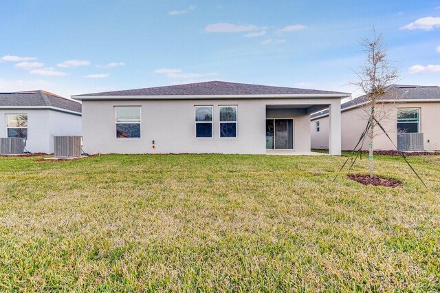 349 River Front Way, Edgewater, FL 32141 - back of property featuring central AC and a yard
