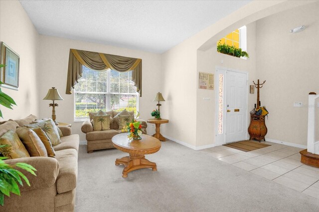 carpeted living room with a textured ceiling