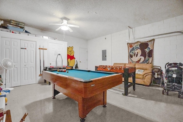 rec room with a textured ceiling, ceiling fan, electric panel, and pool table