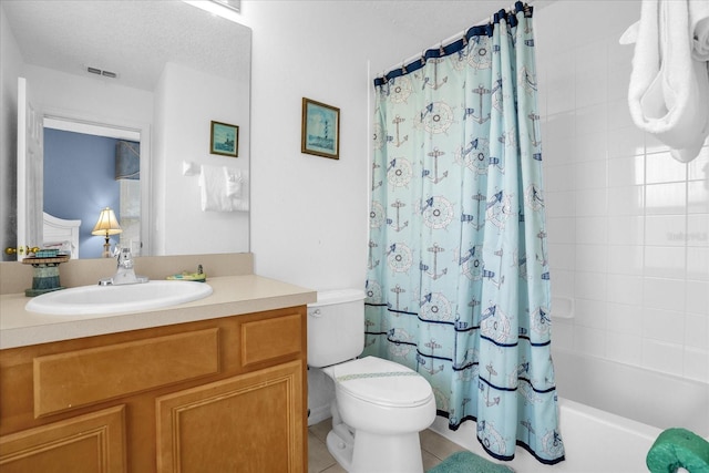 full bathroom with shower / tub combo with curtain, tile patterned floors, a textured ceiling, vanity, and toilet