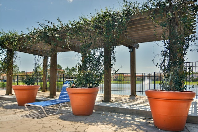 view of home's community featuring a pergola and a patio area