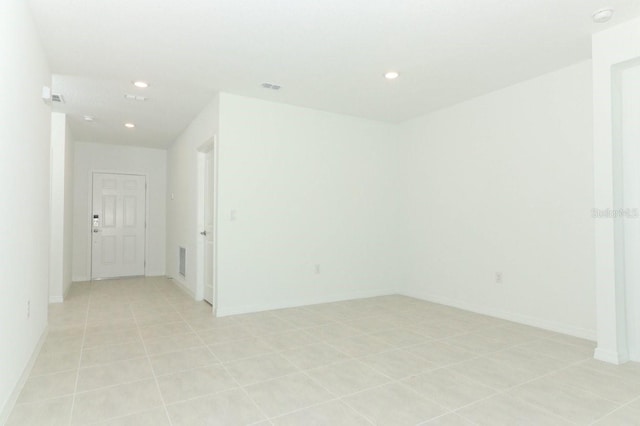 spare room featuring light tile patterned floors