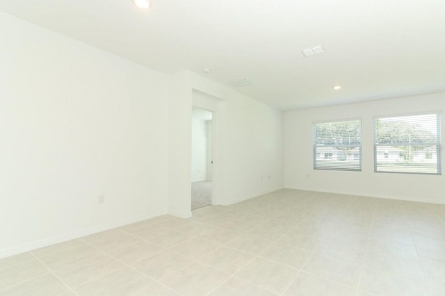 empty room featuring light tile patterned floors