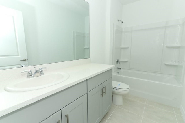 full bathroom with vanity, bathing tub / shower combination, toilet, and tile patterned floors