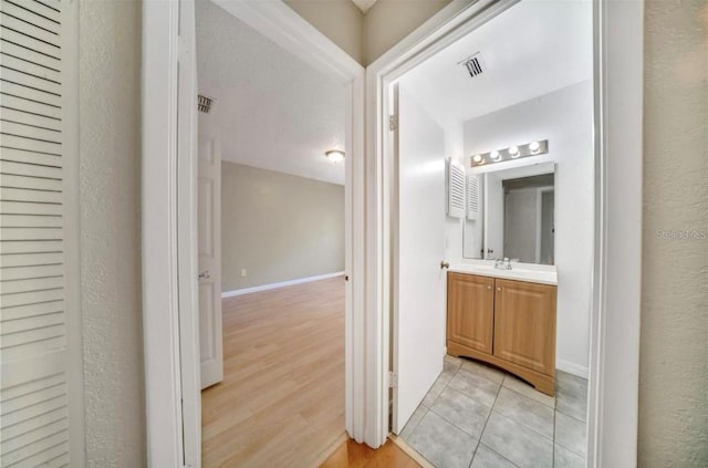 interior space with light wood-type flooring and sink