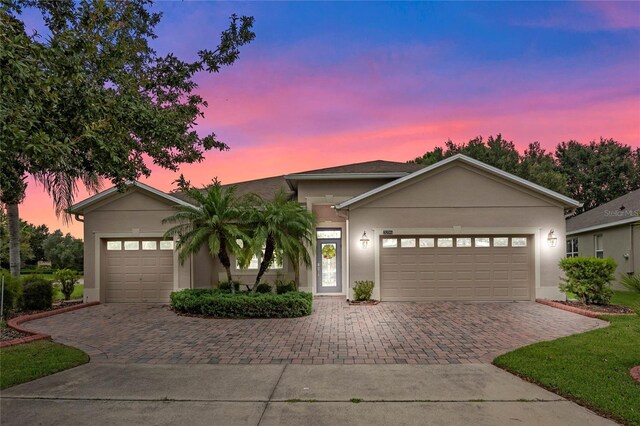 ranch-style home with a garage