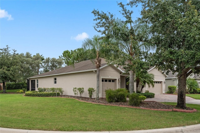 ranch-style house featuring a front yard and a garage