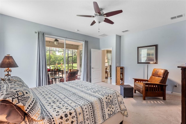 bedroom featuring access to outside, light colored carpet, and ceiling fan