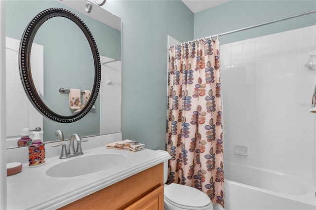 full bathroom featuring shower / bath combo with shower curtain, vanity, and toilet