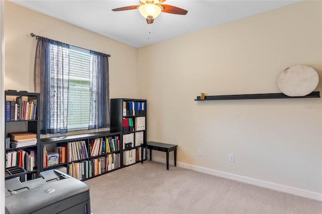 sitting room featuring ceiling fan and light carpet