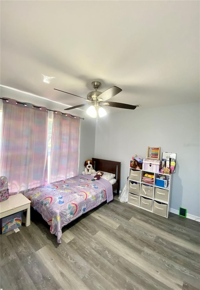 bedroom with ceiling fan and wood-type flooring