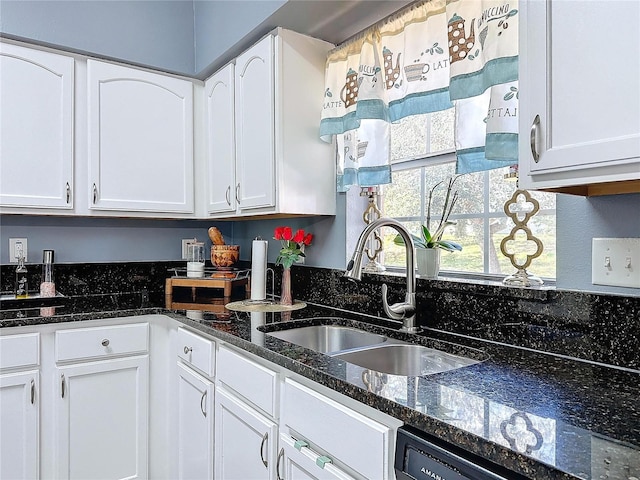 4490 Treasure Cay Rd, Tavares, FL 32778 - kitchen with a sink, white cabinets, and dark stone counters