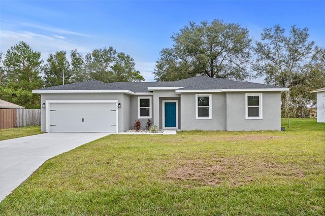 ranch-style home with a front lawn and a garage