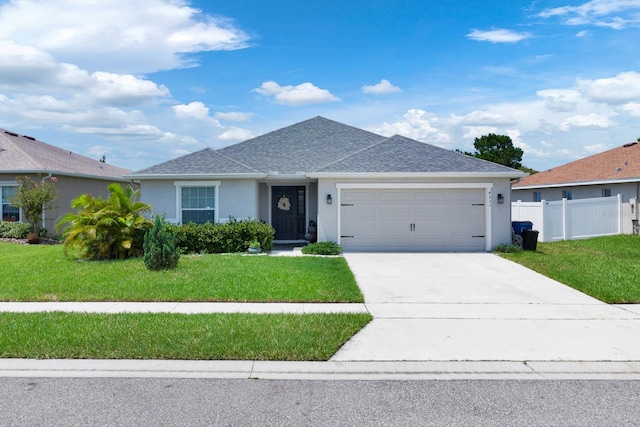 ranch-style house with a garage and a front yard