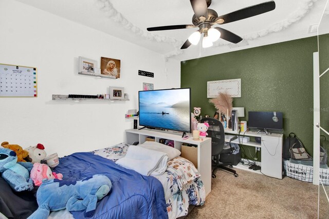 bedroom featuring ceiling fan and carpet flooring